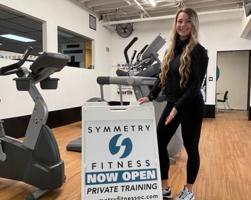 Symmetry Fitness team member at gym opening